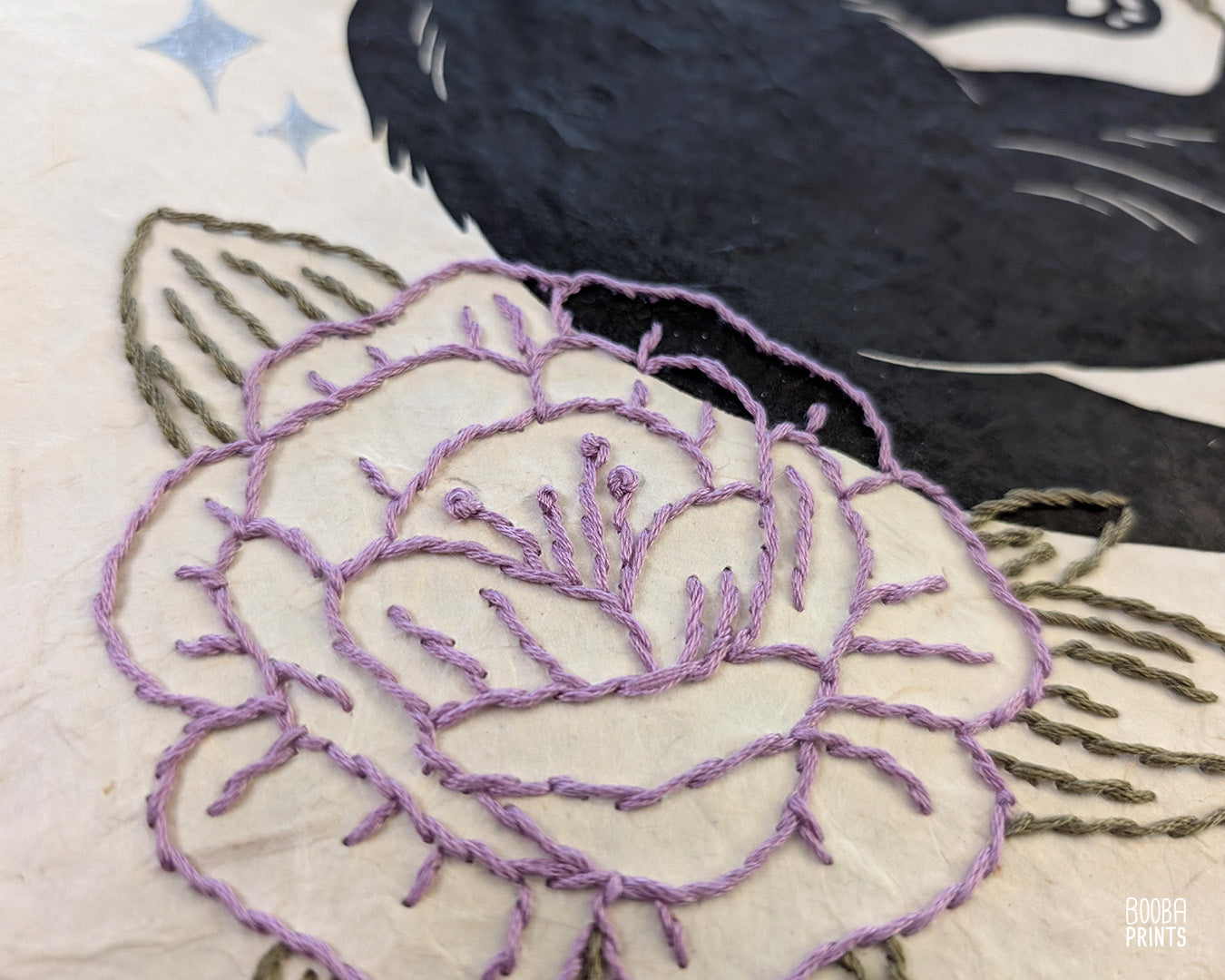 Original hand printed and hand embroidered linocut print. "Cat In Spring Time" is a linocut print, printed by hand, featuring a sleepy black cat, surrounded by  hand embroidered flowers and metallic stars. Print is available in 2 version. A unique original mixed media art piece for cat lovers. Beautiful special gift for your cat loving friend. Cat art wall by Booba Prints.