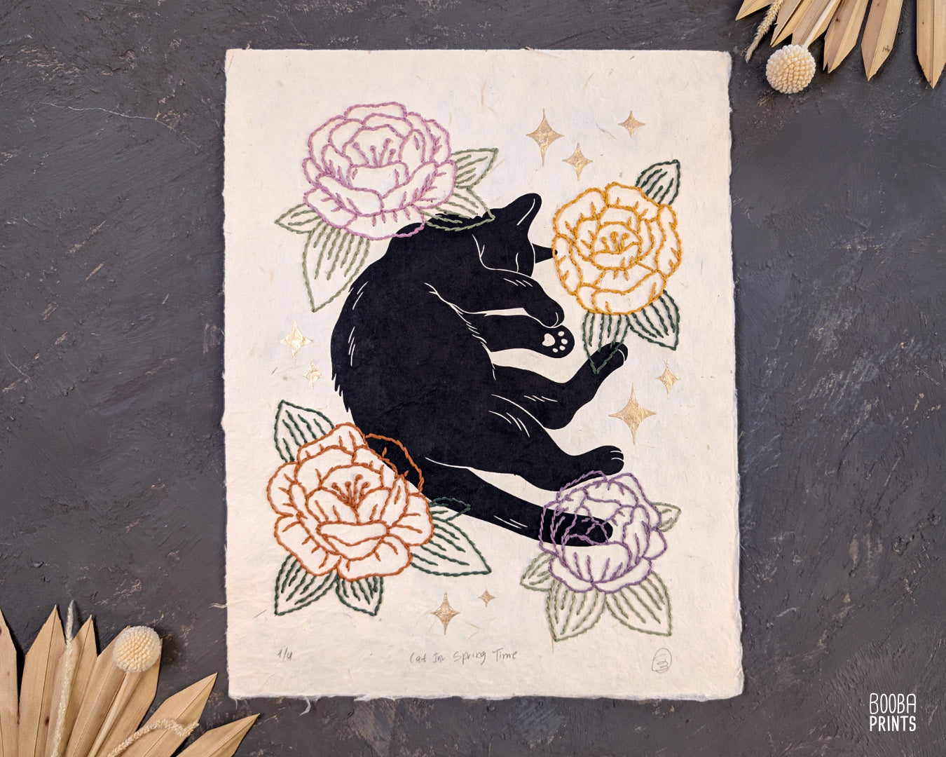 Original hand printed and hand embroidered linocut print. "Cat In Spring Time" is a linocut print, printed by hand, featuring a sleepy black cat, surrounded by  hand embroidered flowers and metallic stars. Print is available in 2 version. A unique original mixed media art piece for cat lovers. Beautiful special gift for your cat loving friend. Cat art wall by Booba Prints.