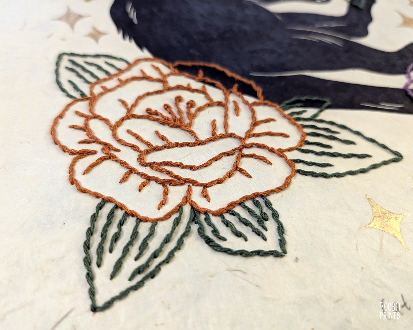 Original hand printed and hand embroidered linocut print. "Cat In Spring Time" is a linocut print, printed by hand, featuring a sleepy black cat, surrounded by  hand embroidered flowers and metallic stars. Print is available in 2 version. A unique original mixed media art piece for cat lovers. Beautiful special gift for your cat loving friend. Cat art wall by Booba Prints.