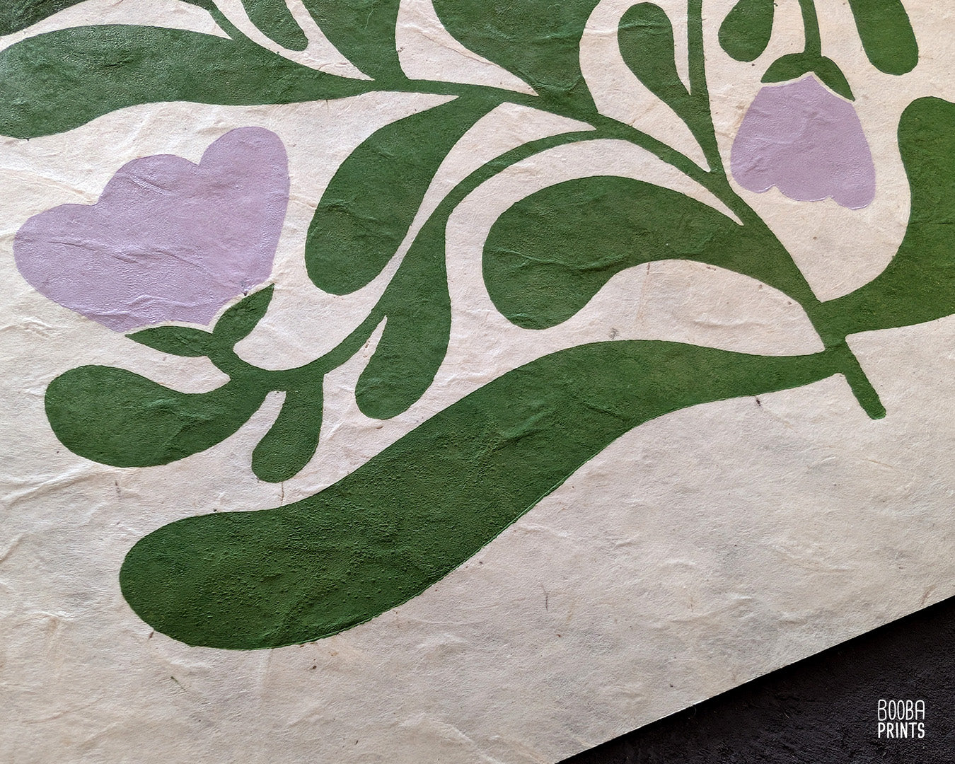 Close up on original edition of "Garden Bloom" linocut print. Non embroidery version of an original print, printed in green and lavender on natural Lokta paper. Art by Booba Prints