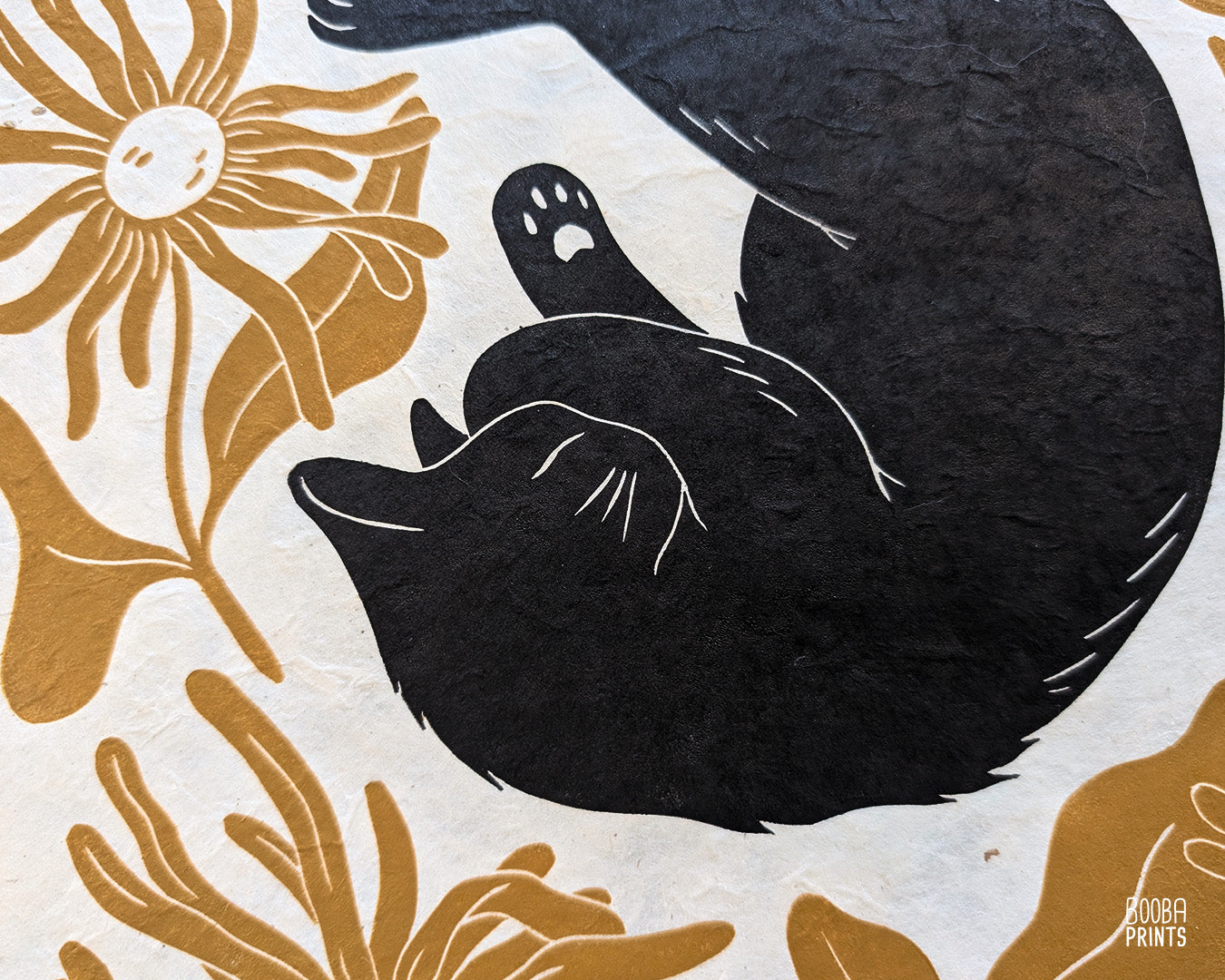 Original handmade linocut "Shy Cat" print. Featuring a cute black cat, covering his face while sleeping, and surrounded by flowers in Ochre yellow. Printed by hand with oil based ink. Original artwork for cat lover, gift for cat lover. A print from the series - "Cats and Plants" by Booba Prints.