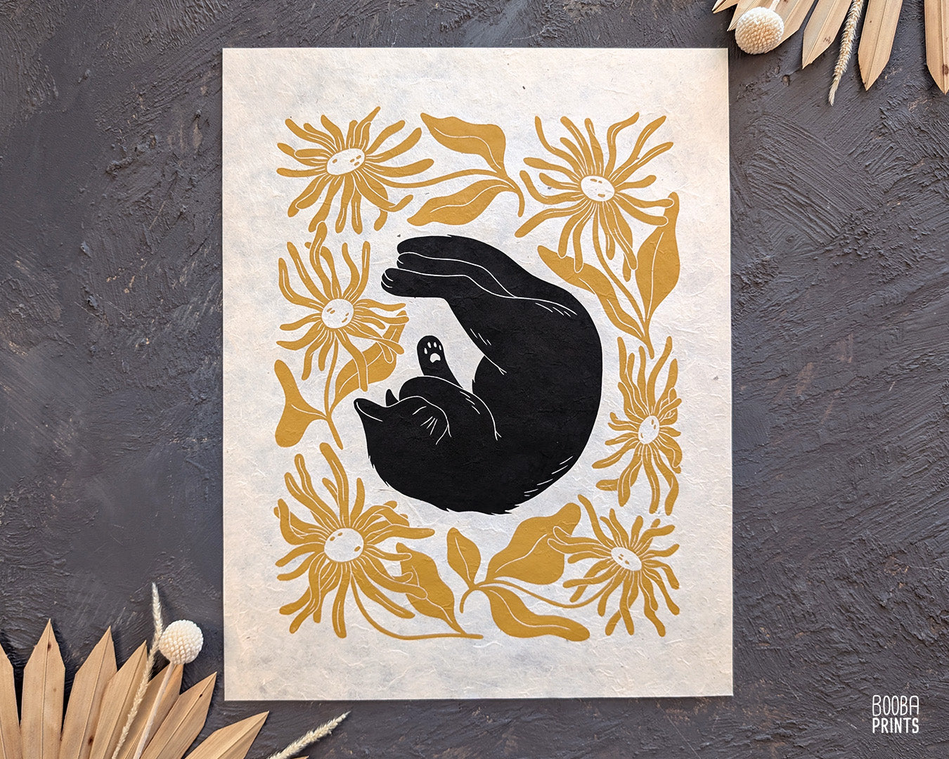 Original handmade linocut "Shy Cat" print. Featuring a cute black cat, covering his face while sleeping, and surrounded by flowers in Ochre yellow. Printed by hand with oil based ink. Original artwork for cat lover, gift for cat lover. A print from the series - "Cats and Plants" by Booba Prints.