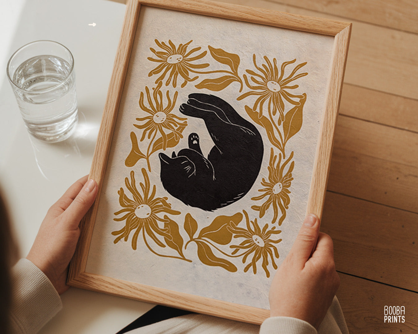 Original handmade linocut "Shy Cat" print. Featuring a cute black cat, covering his face while sleeping, and surrounded by flowers in Ochre yellow. Printed by hand with oil based ink. Original artwork for cat lover, gift for cat lover. A print from the series - "Cats and Plants" by Booba Prints.