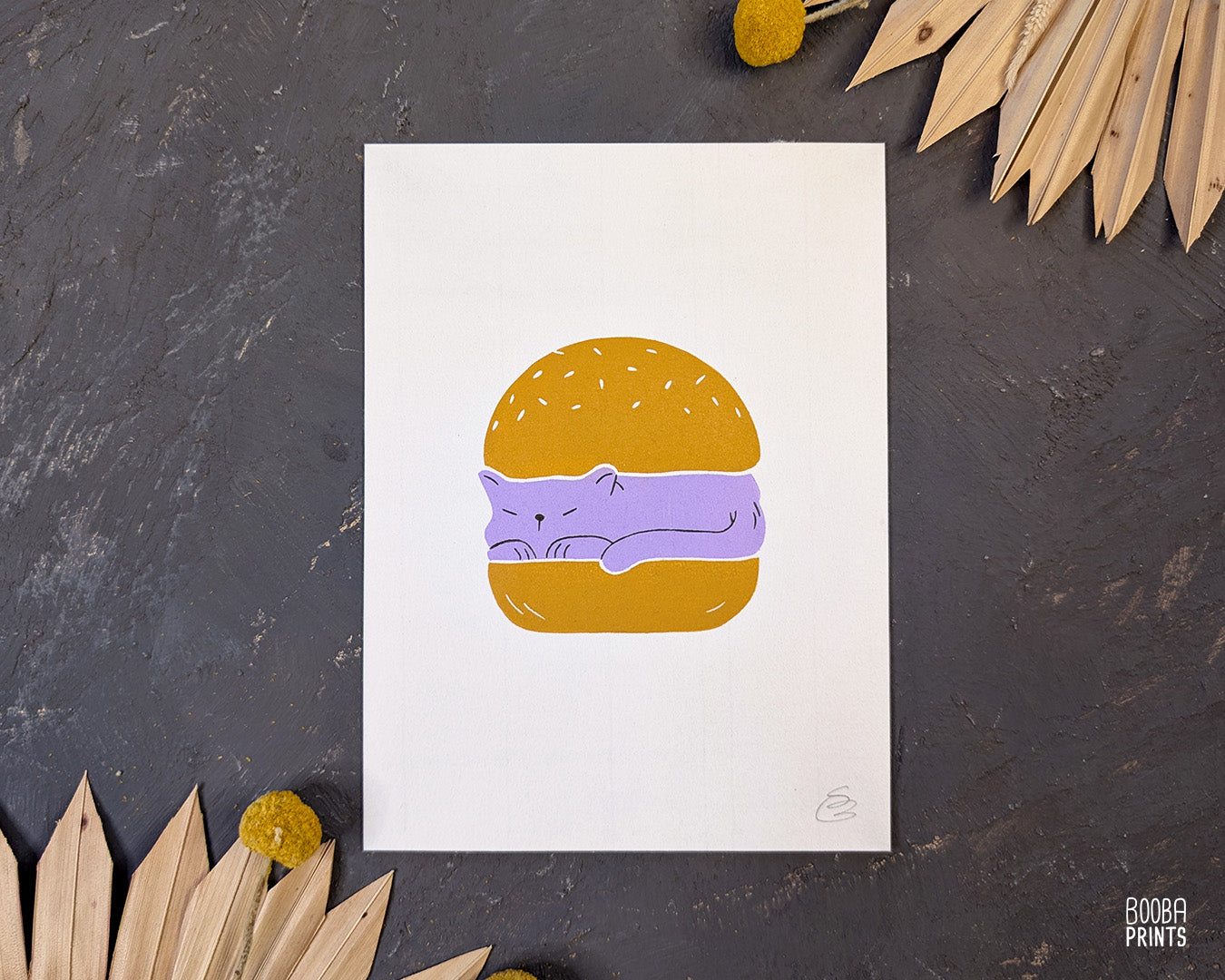 Original handmade linocut print of "Burger Cat" featuring a cute cat between 2 burger buns. Printed in 2 colors: lavender and yellow ochre. Original linocut print in he size of 6"x8". Art by Booba Prints