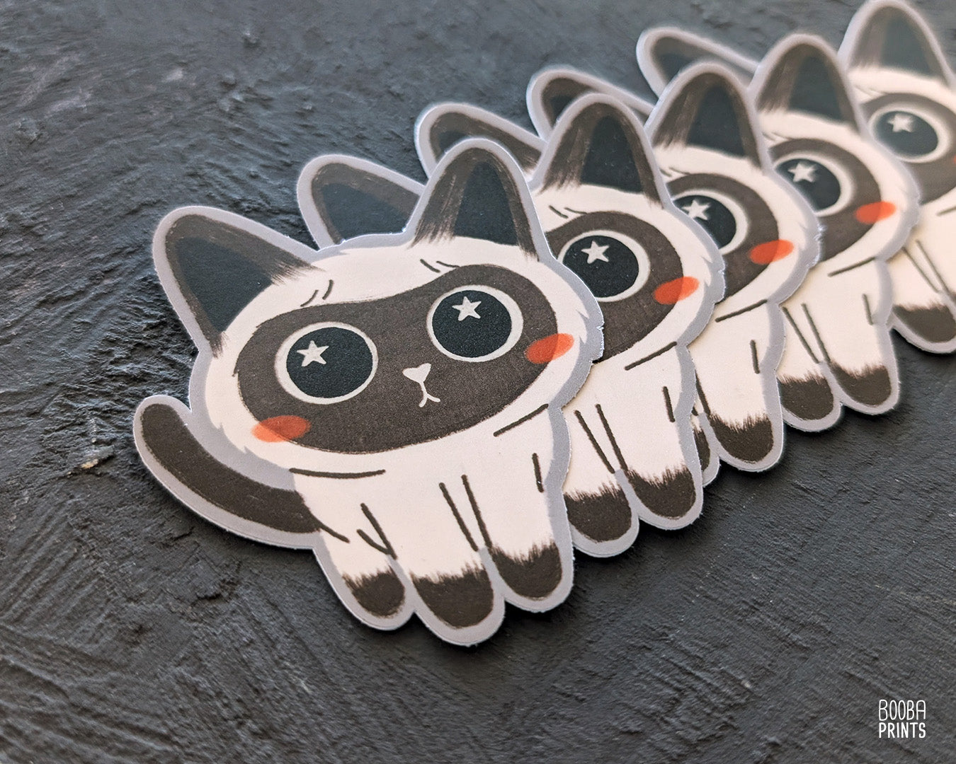 Cute stylized Siamese cat sticker against a grey background. Adorable sticker for cat lovers. Waterproof vinyl sticker for planner, bottle, laptop.