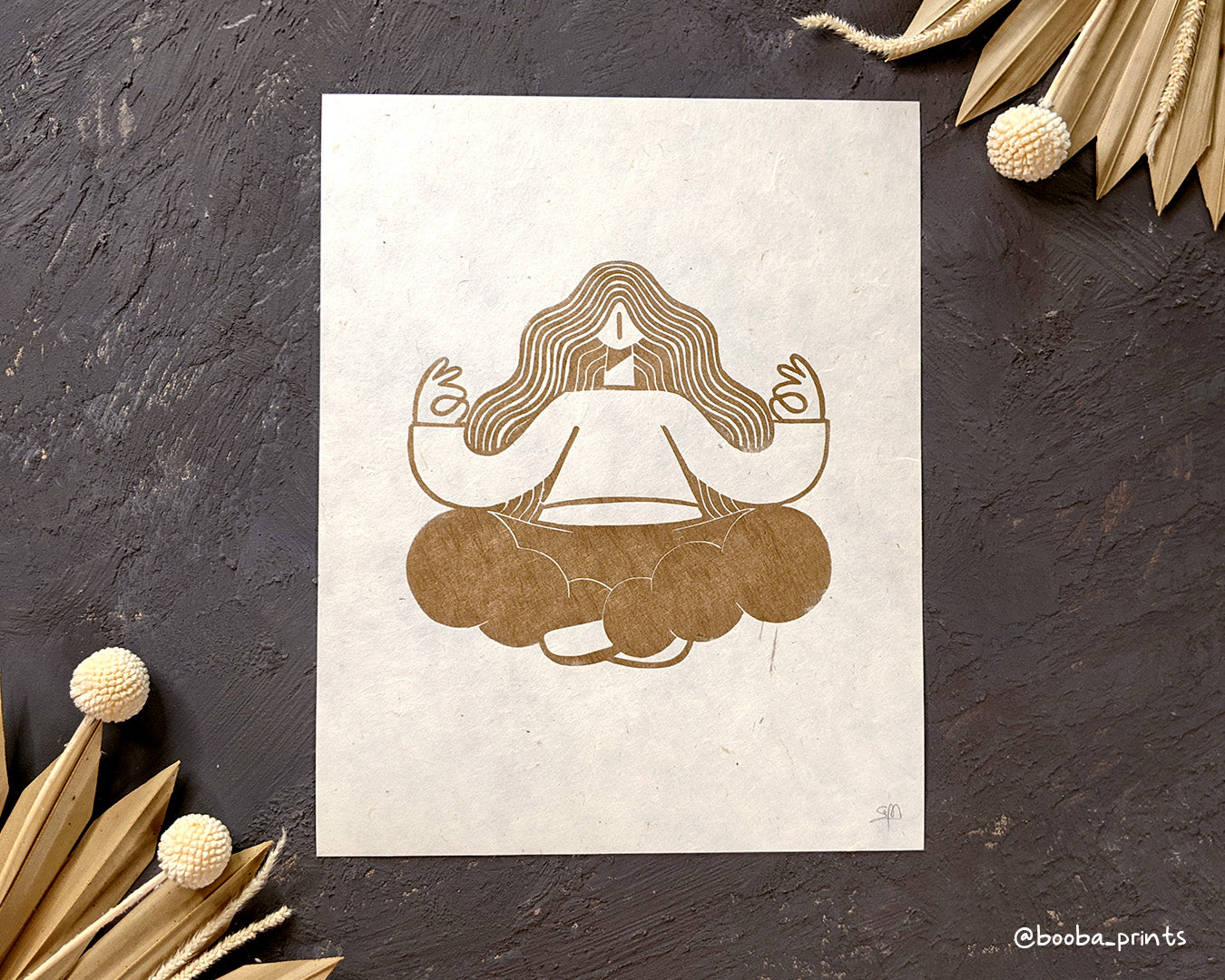 Handmade linocut print of Golden Meditation. stylized illustration of a woman sitting in meditation pose. Super Seconds Festival, sale of samples and seconds, art by Booba Prints