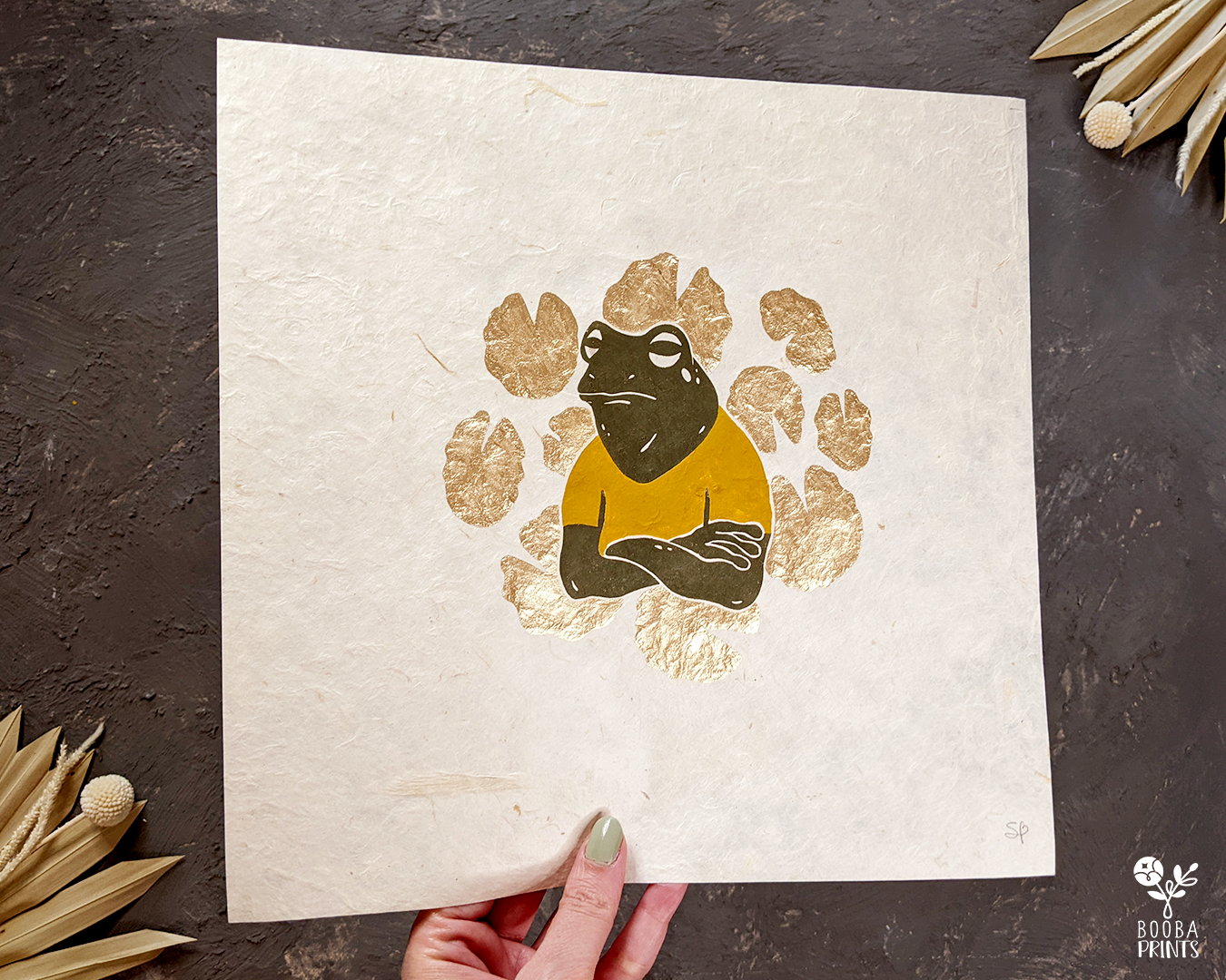 Original handmade linocut print of Senor Frog surrounded by Lily pads. Mixed media piece combining oil based print printmaking with gouache paint and metallic paint. Printed on Lokta paper or BFK Rivers printmaking paper. Cranky frog print for home decor. Print for gallery wall. Animal lover print. Art by Booba Prints.