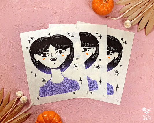 Original handmade and hand printed linocut print of Vampire Girl. Mixed media original piece of a woman vampire surrounded by stars. Printed with a 2 color gradient of black and purple, and finished with colored pencils with black and orange. Printed with oil based ink on Lokta paper 55 gsm. Whimsical art for home decor. Modern woman portrait. Art by Booba Prints.