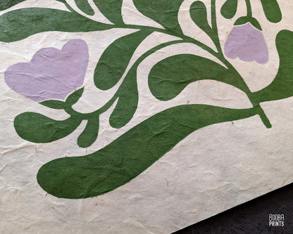 Close up on original edition of "Garden Bloom" linocut print. Non embroidery version of an original print, printed in green and lavender on natural Lokta paper. Art by Booba Prints