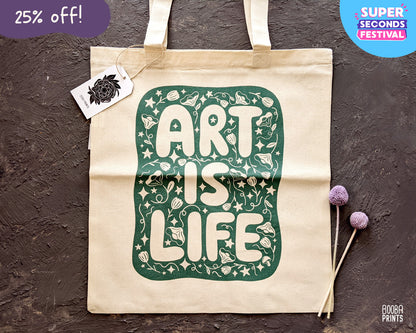 Art Is Life organic tote bag, original design printed in green on organic cotton tote bag, everyday bag, errands bag, gift for artists, art lover gift, printed digitally by a local vendor. Art by Booba Prints.
💙 This print is part of Super Seconds Festival where I sell samples and seconds in reduced prices in up to 70% off. Some prints have imperfections, and some prints are samples that never found the right home.

