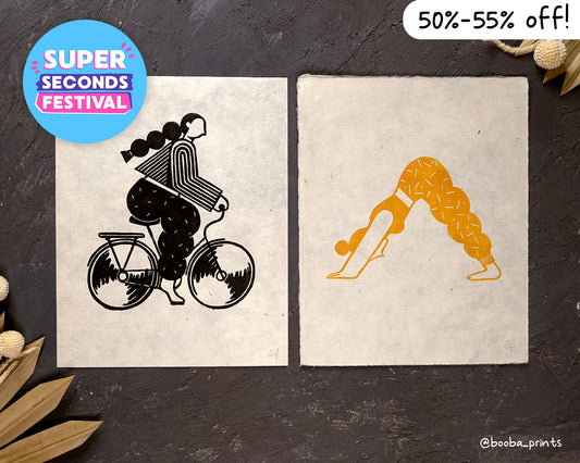 Handmade linocut print set of Active Girl. Stylized illustrations of Biking Girl and Yoga Girl, printed in oil based ink in black and  yellow on natural Lokta paper. Super Seconds Festival, sale of seconds and samples, artwork by Booba Prints