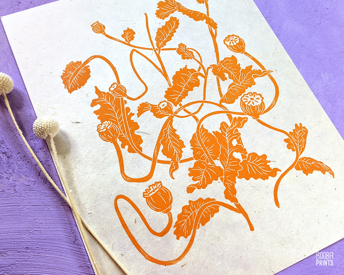 handmade linocut print of flowers. Orange ink on natural paper. Floral print for home decor. Super Seconds Festival, online UK based sale of samples and seconds. Art by Booba Prints.
