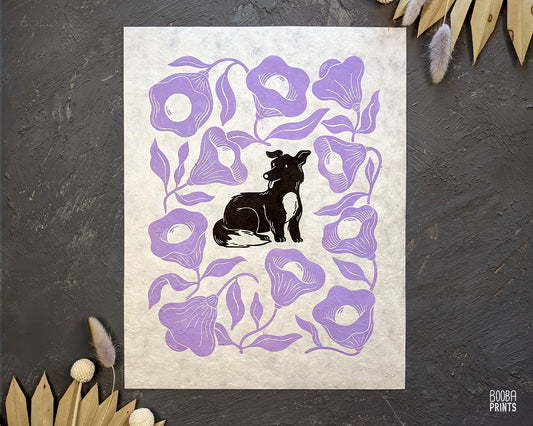 Original handmade linocut print of Happy Dog & Purple Flowers. 2 color hand printed design, printed by hand with black and purple ink on natural Lokta paper 50 gsm, dog lover gift, cute dog print, birthday or housewarming gift, flower lover and dog lover gift. Art by Booba Prints