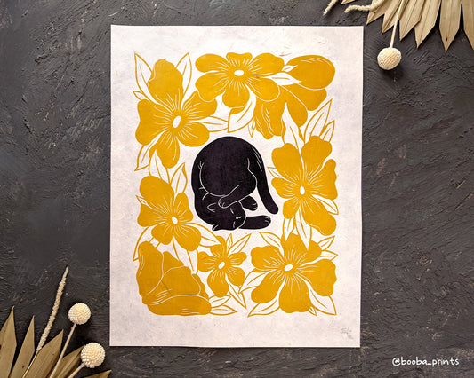 Handmade linocut print of lazy cat and yellow flowers. Original handmade linocut print of black cat. cute cat print. Cat lover print for gallery wall. wall art print. Art by Booba Prints