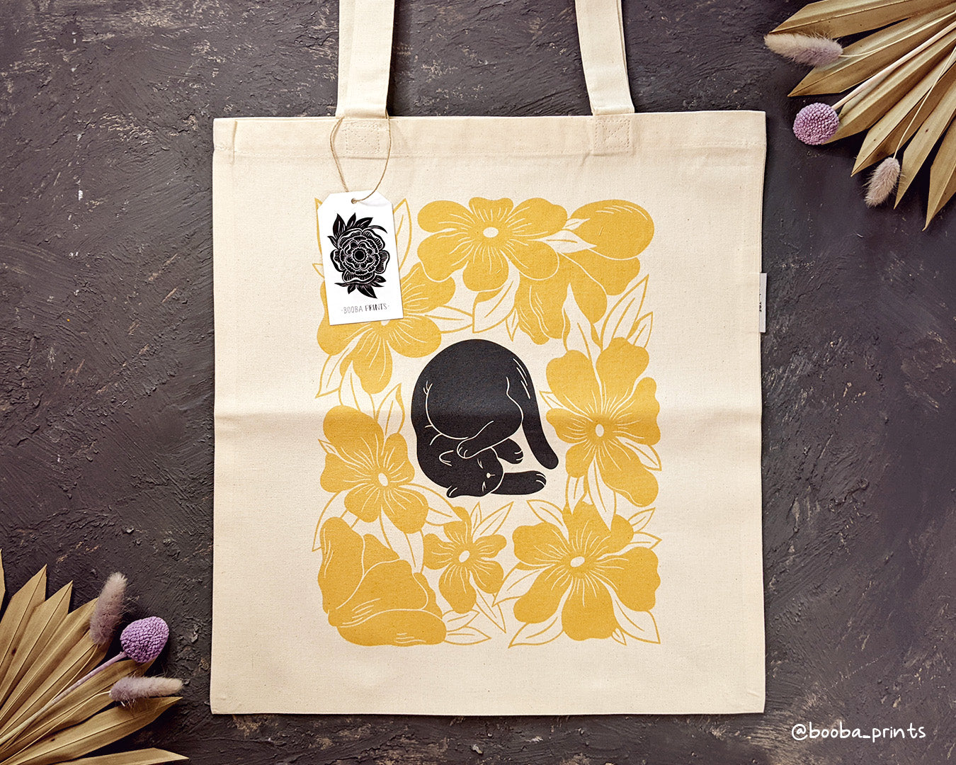 Lazy Cat design of black cat and yellow flowers is now available as tote bag. Organic cotton tote bag, everyday tote bag, cute tote bag cat design, art by Booba Prints