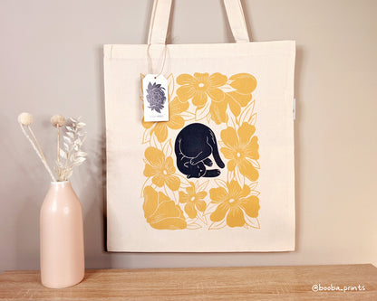 Lazy Cat design of black cat and yellow flowers is now available as tote bag. Organic cotton tote bag, everyday tote bag, cute tote bag cat design, art by Booba Prints