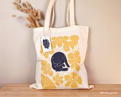 Lazy Cat design of black cat and yellow flowers is now available as tote bag. Organic cotton tote bag, everyday tote bag, cute tote bag cat design, art by Booba Prints