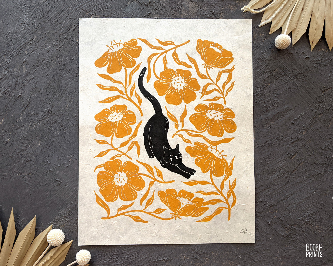 Handmade original linocut print of Stretchy Cat, a black cat and orange flower linocut print. Gift for cat lover or a flower lover. Housewarming gift. Mother's Day gift. Artwork for home decor. Gallery wall print. Art by Booba Prints