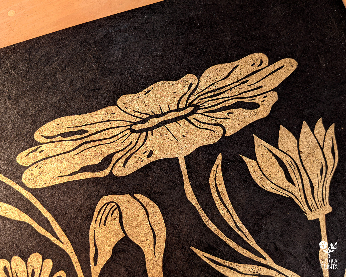 Handmade and original linocut floral print. Floral composition printed in metallic gold on black Lokta paper. Flower love gift. Floral print by Booba Prints. Print for home decoration and gallery wall. Decor lover gift. Art by Booba Prints