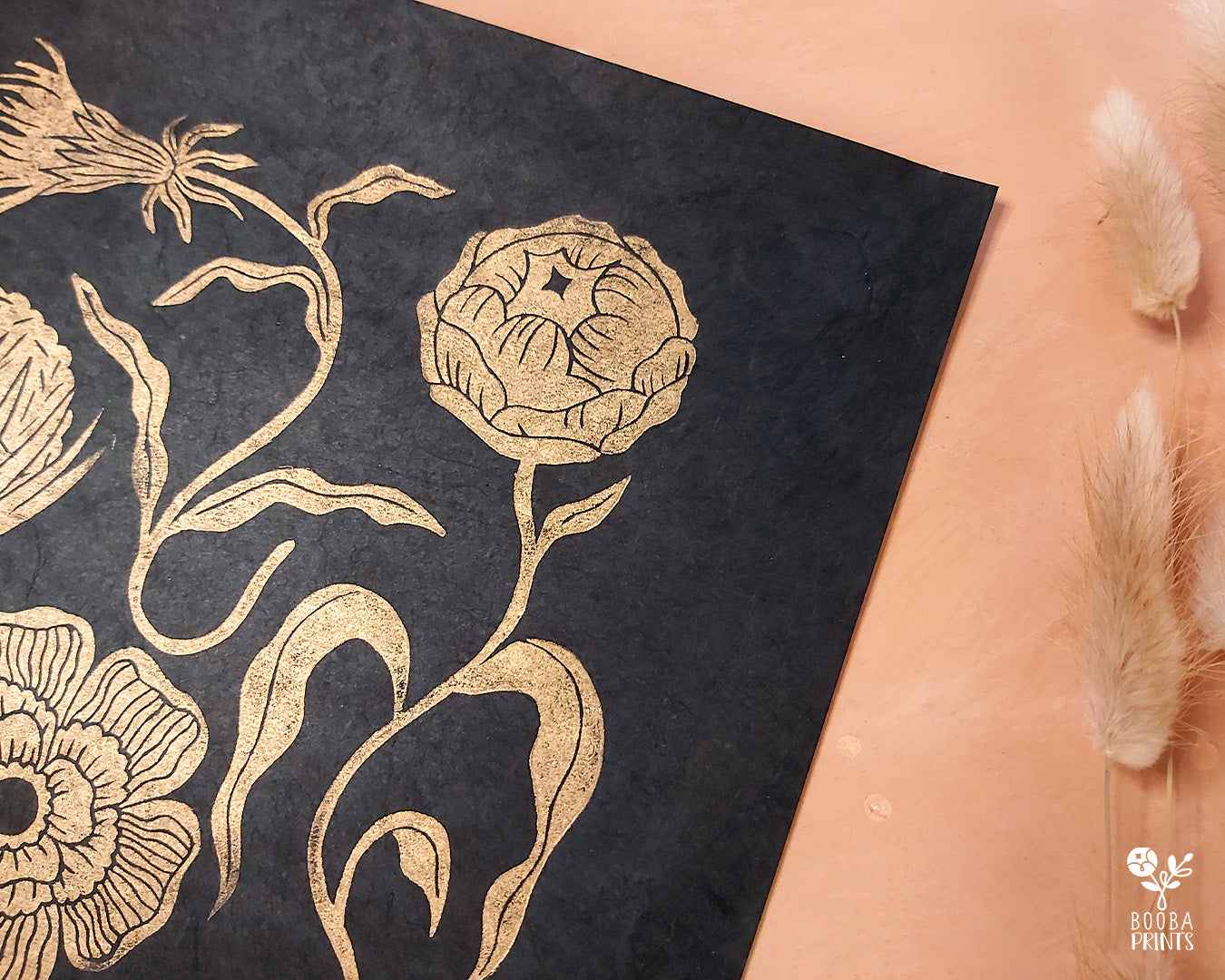 Handmade and original linocut floral print. Floral composition printed in metallic gold on black Lokta paper. Flower love gift. Floral print by Booba Prints. Art by Booba Prints